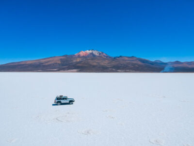 4WD vehicle driving in the northern part of Salar de Uyuni, Bolivia
