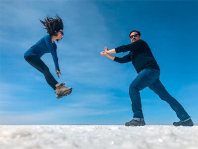 Couple enjoying fun photography during a Salar de Uyuni Travel Experience